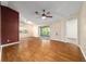 Spacious living room with wood floors and sliding glass doors at 9001 Sw 91St Cir, Ocala, FL 34481