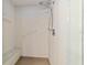 Inside the shower showing the updated fixtures, bench seat, and tiled walls at 9001 Sw 91St Cir, Ocala, FL 34481