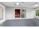Well-lit sunroom featuring sliding doors and neutral decor at 9001 Sw 91St Cir, Ocala, FL 34481