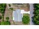 A bird's-eye view of a single-Gathering home with a long driveway and ample parking, nestled in a serene neighborhood at 9021 Sw 108Th Pl, Ocala, FL 34481