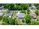 A serene aerial view of a single-story home with a charming backyard, surrounded by green trees and a well-kept lawn at 9021 Sw 108Th Pl, Ocala, FL 34481