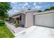 Home with a one-car garage and a cozy, fenced patio area, ideal for outdoor dining at 9021 Sw 108Th Pl, Ocala, FL 34481