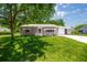 Inviting single-story home with a well-manicured lawn and covered entry for curb appeal at 9021 Sw 108Th Pl, Ocala, FL 34481