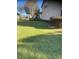 Expansive backyard showcases a beautifully maintained lawn and mature landscaping around the property at 9170 Sw 65Th Loop, Ocala, FL 34481