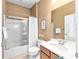 Well-lit bathroom with a shower over the tub and a classic vanity at 9170 Sw 65Th Loop, Ocala, FL 34481