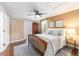 Charming bedroom featuring a wooden bed frame, ceiling fan, and a cozy, inviting atmosphere at 9170 Sw 65Th Loop, Ocala, FL 34481