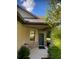 Inviting front porch with stone accents and a charming blue front door at 9170 Sw 65Th Loop, Ocala, FL 34481