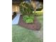 Well-manicured front yard features a stone pathway, verdant greenery, and an inviting curb appeal at 9170 Sw 65Th Loop, Ocala, FL 34481