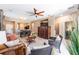 Cozy living room with a ceiling fan, ample seating, and a view of the dining area at 9170 Sw 65Th Loop, Ocala, FL 34481