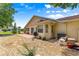Charming backyard featuring a stone landscape design and a covered patio area perfect for relaxing at 9266 Sw 91St Cir, Ocala, FL 34481
