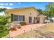 A backyard featuring a patio area with charming wicker furniture, perfect for enjoying the outdoors at 9266 Sw 91St Cir, Ocala, FL 34481