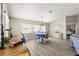 Bright dining area with modern chandelier, wood floors, and views through large window at 9266 Sw 91St Cir, Ocala, FL 34481
