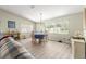 Well-lit dining area featuring a chandelier, and large windows at 9266 Sw 91St Cir, Ocala, FL 34481