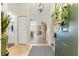 Inviting entryway with stylish flooring, closet, and a glimpse into the living spaces at 9266 Sw 91St Cir, Ocala, FL 34481