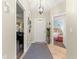 Bright entryway with neutral tones, showcasing access to multiple rooms and stylish decor at 9266 Sw 91St Cir, Ocala, FL 34481