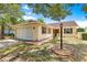 Welcoming home with a well-kept lawn, attached garage, and pleasant curb appeal at 9266 Sw 91St Cir, Ocala, FL 34481