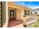 Charming porch area featuring decorative pillars and a welcoming entrance door at 9266 Sw 91St Cir, Ocala, FL 34481