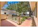 Cozy front porch with a low railing offering a view of the landscaped yard and neighborhood at 9266 Sw 91St Cir, Ocala, FL 34481