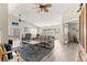 Open-concept living room with high ceilings, wood flooring, and bright windows at 9266 Sw 91St Cir, Ocala, FL 34481