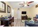 Bright living room with golf decor, wood flooring, and a comfortable seating area at 9266 Sw 91St Cir, Ocala, FL 34481