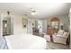 Relaxing bedroom with wood floors and access to bathroom and living areas at 9266 Sw 91St Cir, Ocala, FL 34481