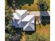 Overhead shot of home highlighting its metal roof, modern design, and lush surroundings at 9330 Se 106Th Pl, Belleview, FL 34420