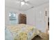 Cozy bedroom with wood furnishings, and a floral-themed comforter, offers a warm ambiance at 9330 Se 106Th Pl, Belleview, FL 34420