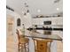 Modern kitchen with dark countertops, white cabinets, and stainless steel appliances at 9330 Se 106Th Pl, Belleview, FL 34420