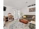 Cozy living room with a brown sofa, wooden coffee table, and a stylish round rug at 9330 Se 106Th Pl, Belleview, FL 34420