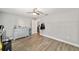Bright bedroom featuring wood laminate flooring and a soothing color palette at 11 Se Fir Trail Trak, Ocala, FL 34472