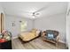 Cozy bedroom with a soft color scheme, comfy chair, and a window letting in natural light at 11 Se Fir Trail Trak, Ocala, FL 34472