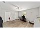 Spacious bedroom featuring a ceiling fan, wood laminate flooring and ample natural light at 11 Se Fir Trail Trak, Ocala, FL 34472