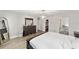 Spacious bedroom boasts wood floors, a large dresser, and walk-in closet at 11 Se Fir Trail Trak, Ocala, FL 34472