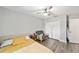 Cozy bedroom with a soft color scheme, comfy chair, and large closet for storage at 11 Se Fir Trail Trak, Ocala, FL 34472