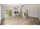 Bright, open-concept living room with modern furnishings, and access to kitchen and dining area at 1143 Sw Tamiami Pl, Dunnellon, FL 34431