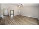 Spacious living room featuring durable floors, neutral paint and ceiling fan at 1143 Sw Tamiami Pl, Dunnellon, FL 34431