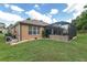 Lush backyard featuring a pool with enclosure, providing a refreshing escape with ample space for relaxation and entertainment at 12804 Se 90Th Court Rd, Summerfield, FL 34491