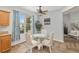 Breakfast nook featuring a glass table, seating for four, natural light, and backyard views at 12804 Se 90Th Court Rd, Summerfield, FL 34491