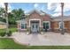 Beautiful single-story home with a manicured lawn, stone accents, and a walkway to the front door at 12804 Se 90Th Court Rd, Summerfield, FL 34491