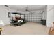 Spacious garage featuring a golf cart and ample parking for a vehicle at 12804 Se 90Th Court Rd, Summerfield, FL 34491