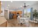Bright kitchen and breakfast nook with stainless appliances, generous cabinets, and outdoor views at 12804 Se 90Th Court Rd, Summerfield, FL 34491