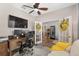 The office has a comfortable seating area and a functional desk with double monitors at 12804 Se 90Th Court Rd, Summerfield, FL 34491