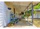 The home features a delightful back porch with ample potted plants and greenery at 1405 Ne 55Th St, Ocala, FL 34479
