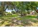 Expansive backyard with mature trees providing ample shade at 1405 Ne 55Th St, Ocala, FL 34479