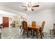 Bright dining room with vintage floors and a classic chandelier at 1405 Ne 55Th St, Ocala, FL 34479