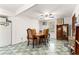Bright dining room with vintage floors and a classic chandelier at 1405 Ne 55Th St, Ocala, FL 34479