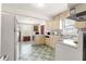 Kitchenette with marble counters and seating, seamlessly integrated into the dining area at 1405 Ne 55Th St, Ocala, FL 34479