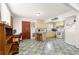 Kitchenette with marble counters and seating, seamlessly integrated into the dining area at 1405 Ne 55Th St, Ocala, FL 34479