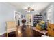 Inviting living room with hardwood floors, natural light, and cozy reading nook featuring bookshelves at 1405 Ne 55Th St, Ocala, FL 34479