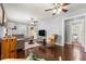 Bright living room featuring hardwood floors, a comfortable gray couch, and natural light from the windows at 1405 Ne 55Th St, Ocala, FL 34479